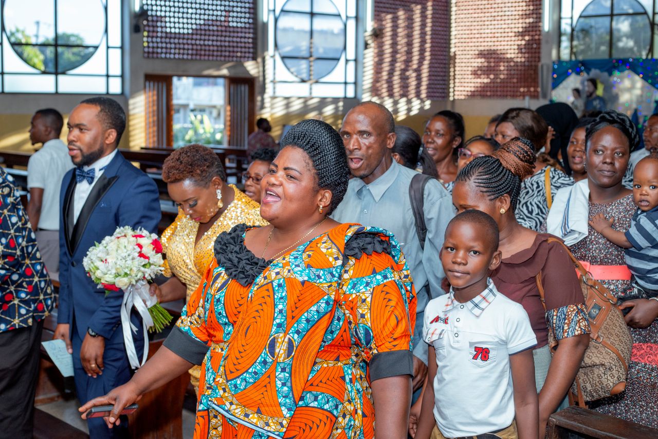 Vibrant gathering during a joyful ceremony at a church, showcasing diverse community interactions.
